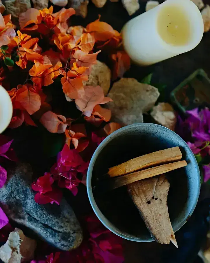 Candles, flowers and a bowl prepared for a session